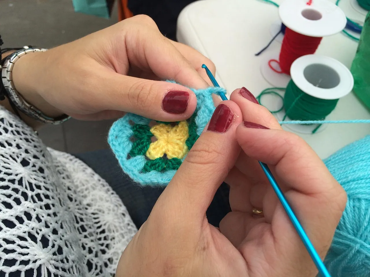 how to use crochet flowers on your scrapbook page;crochet flower scrapbook layouts; crochet flower page inspiration; using crochet flowers on layouts; yarn flower scrapbook embellishments; document memories using crochet flowers;